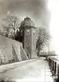 Die Landesstraße 352 an der Schlossmauer (um 1900)