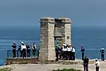 Eine Besuchergruppe an der Glocke