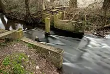 Ölbach mit historischem Stauwehr