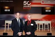 Festakt zu 50 Jahren Notruf 110/112 in Berlin: Volker Wissing, Bundesminister für Digitales und Verkehr, und Pierre-Enric Steiger, Präsident der Björn Steiger Stiftung
