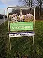 Willkommensschild der Dorfgemeinschaft