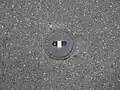 Runde Straßenkappe (Absperrschieber einer Wasserleitung)