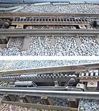 oben: die Bremszahnräder konphas machende Lamelle, Einfahrt von linksunten: Einfahrlamelle mit hydraulisch gedämpfter Rückstelleinrichtung (links, zweifach), Einfahrt von rechts