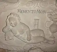 Stiftskirche St. Georg, Tübingen. Detail von einem der Grabmonumente: Memento mori. Dem Stil nach (Putte) aus dem Barock.