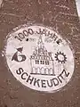 Teil einer alten Außenwerbung der VEB Edelpelz „1000 Jahre Schkeuditz“ (Aufnahme von 2005)