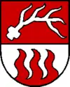 aus dem Schildfuß aufsteigende Flammen (Kronstorf AT)