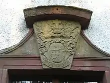 Wappenstein über dem Eingang Jagdschloss Giesel von 1717