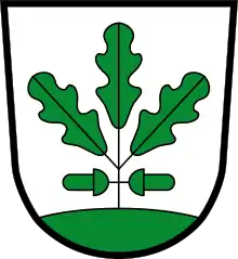 Stilisierte Eiche, bestehend aus drei Blättern und zwei Eicheln, im Wappen von Eichenau, Bayern