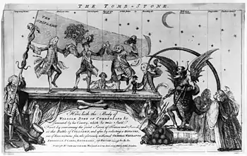 Wilhelm August, Duke of Cumberland. Der Grabstein. Der Druck zeigt mehrere Männer, George Grenville, Lord Bute, den Herzog von Bedford und als einen kleinen Hund in klerikaler Robe Dr. W. Scott mit der Aufschrift „AntiSejanus“, die auf einem Sarkophag mit Flachreliefs mit den Themen „Britannia“ und „America“ tanzen, der die Inschrift trägt: „Hier liegt der Körper von Wilhelm, Duke of Cumberland &c betrauert von seinem Land, das er zweimal rettete. Zuerst, indem er es bezwang … und danach, indem er ein Kabinett ohne diese wenigen Ehrenhaften wählte, der glorreich der GENERALVOLLMACHT, AMERIKANISCHER PRÄGUNG, STEUERERHÖHUNG, --- &c, &c, &c widerstand.“ Zur linken steht Lord Sandwich (Jemmy Twitcher), der einen Fahnenmast, der mit zwei Schlangen umwunden ist, und ein fliegendes Banner hält, das die Aufschrift „Die Standarte“ trägt und auf dem der Kopf der Medusa erscheint, vermutlich nahelegend, dass das anzustrebende Ideal verfehlt wurde. Hinter dem Sarkophag der Earl of Halifax und zur Rechten steht Earl Temple, der in seiner linken Hand den Schweif des „AntiSejanus“ und des schottischen Teufels umklammert hält, der neben ihm auf einem Buch mit der Aufschrift „Jemmy Twitchers Gesetze für die Bande“; ganz rechts stehen zwei Mitglieder der Klerus.