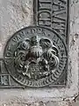 Wappen derer von der Lühe an einer Grabplatte in der Dorfkirche Woosten