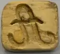 Brotstempel, Rechteckiges Brettchen mit Leistengriff und eingeseiftem kursivem „A“.