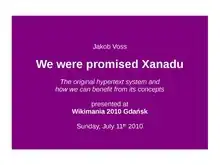 Präsentationsfolie. Weißer Text auf lila Hintergrund. Text (zeilenweise von oben nach unten): „Jakob Voss“, „We were promised Xanadu“, „The original hypertext system and how we can benefit from its concepts“, „presented at“, „WikiMania 2010 Gdańsk“, „Sunday, July 11th 2010“